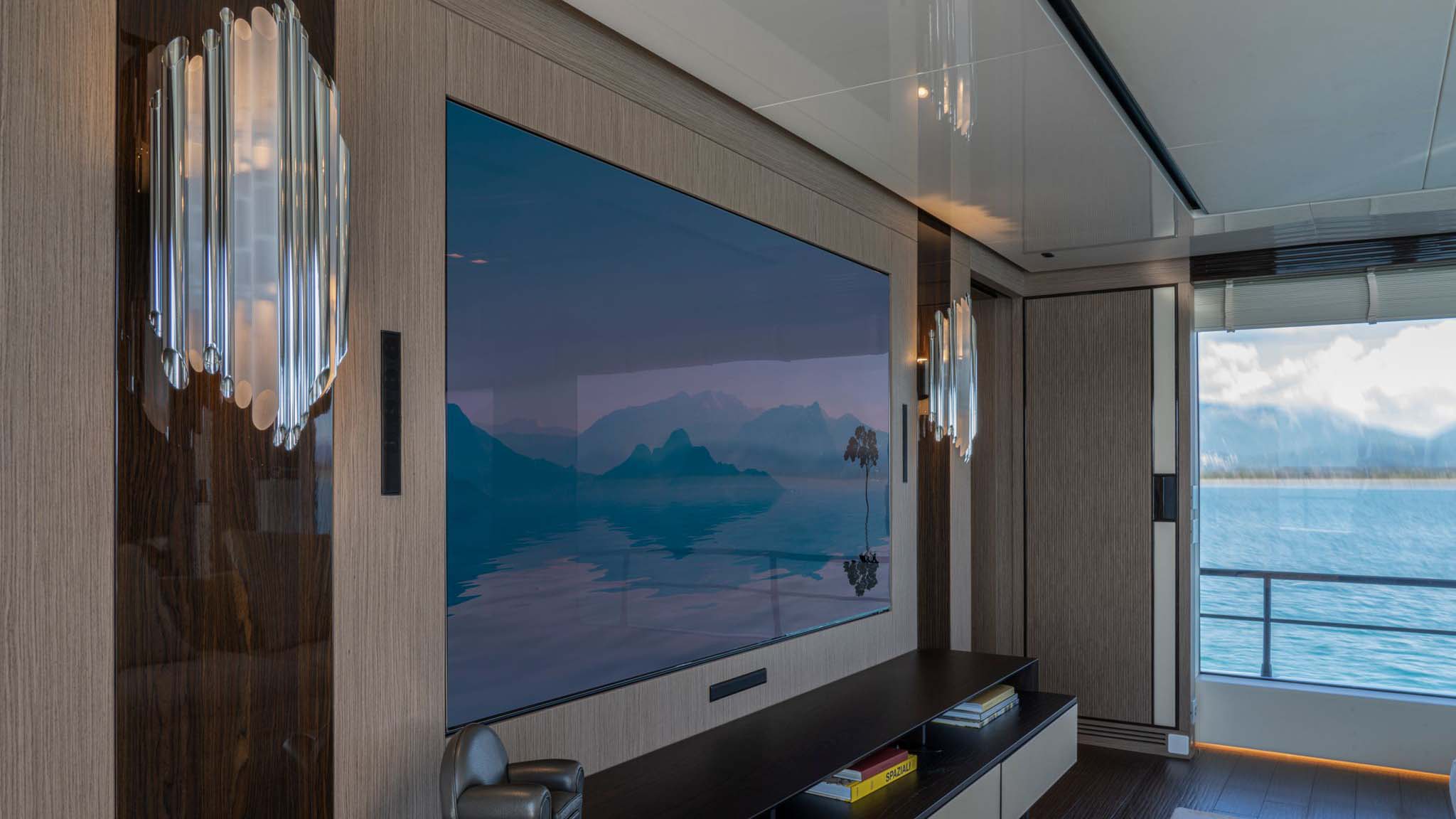 Home theater media room with a view of the ocean out one of the windows